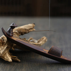 Lonely Fisherman Incense Holder – Clay boat with seated figure and smoke on aged wood, zen decor