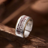 Wu Lu Cai Shen Ring – silver band with red talisman engraving and gold trim on dark wood, wealth luck jewelry