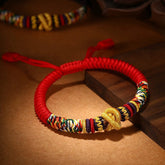 Tibetan Mantra Bracelet – Red cord with gold knots and multicolor woven patterns, lucky knot bracelet
