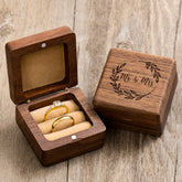 Walnut Wood Ring Box – open box with gold rings and engraved lid on rustic wood, wedding keepsake