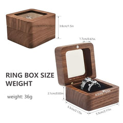 Walnut Wood Ring Box – top-down view of dual ring slots in black velvet interior, compact