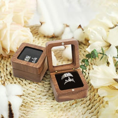 Walnut Wood Ring Box – open box with engagement ring and wedding band on white background