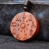 Lightning Struck Jujube Wood Pendant – Carved yin-yang bagua with eight Buddhist mudras and trigram characters on reddish-bro