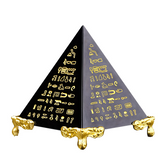 Black obsidian pyramid with gold Egyptian hieroglyphic scripture engravings, ornate gold feet stand, white background, energy protection pyramid