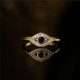 Evil Eye Copper Ring – Gold evil eye ring with sapphire center, diamond pave on black mirror surface