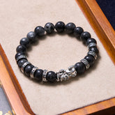 Black Glitter PiXiu Power Bracelet – Black stone beads with silver pixiu charm on suede tray, feng shui