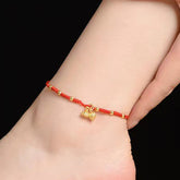 Lotus Pod Red String Anklet – Gold lotus charms on ankle, red string anklet
