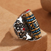 Garuda Dzi Ring – Spinning turquoise and gold mantra barrel with guardian lion reliefs, protective