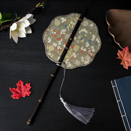 Purple Bamboo Handle Fan – Gold-green brocade with scalloped edge, folding fan