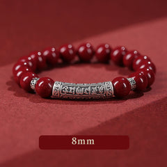 Cinnabar Sterling Silver Six True Words Bracelet – side view with silver Tibetan center bead, 8mm red bracelet