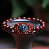 Sandalwood Six True Words Bracelet - Carved centerpiece with turquoise inlay on red wooden beads