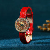 Compass Jade Leather Bracelet – gold filigree medallion with green gemstone on red strap, gemstone jewelry