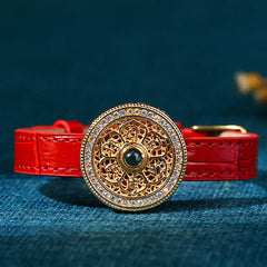 Compass Jade Leather Bracelet – close-up gold openwork medallion with green center stone, healing crystal
