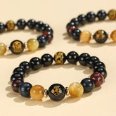 Black Onyx Tiger Eye Natal Buddha Bracelet - three stacked bracelets with gold zodiac charms