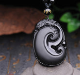 Black Obsidian PiXiu Pendant – Oval carved swirl obsidian with PiXiu head on beaded cord