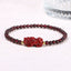 Garnet Cinnabar PiXiu Bracelet – garnet beads red cinnabar PiXiu gold spacers white background, passion jewelry