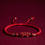 Cinnabar Ruyi Fu PiXiu Red Bracelet – PiXiu bracelet laid flat on red velvet front view, wealth mascot jewelry