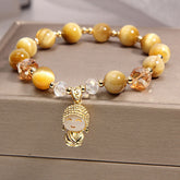 Yellow Tiger Eye Meditation Buddha Bracelet – Front view of golden brown beaded band with Buddha head