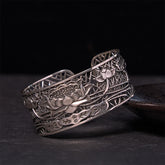 Hollow Lotus Silver Plated Copper Bracelet Bangle – oxidized silver lotus filigree on dark stone, healing balance
