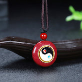 Cinnabar Yin Yang Necklace – red stone pendant with gold trim tai chi symbol, cinnabar jewelry