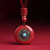 Natural Cinnabar Om Mani Padme Hum Pendant – Frontal view with turquoise center and lotus inlay, cinnabar spiritual jewelry