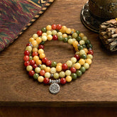 108 Mala Topaz Jasper Lotus Bracelet - coiled on aged wood with ethnic textile, lotus pendant, mindful