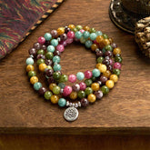 108 Mala Tourmaline Lotus Wisdom Bracelet - multicolor tourmaline beads coiled on wood, Protection