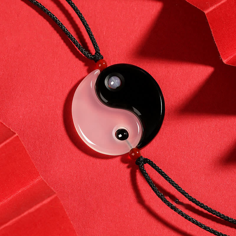 Black Onyx White Agate Yin Yang Necklace - Split obsidian and rose quartz interlocking yin-yang couple pendant set on vibr...