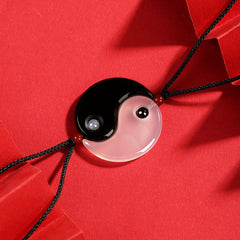 Black Onyx White Agate Yin Yang Necklace - Complete yin-yang pendant showing glossy black obsidian and translucent white a...