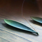 Willow Leaf Ceramic Incense Burner – Long leaf holder on wood grain surface, natural calming decor