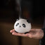 Cute Panda Ceramic Incense Burner – Round panda head held in palm with smoke rising from top vents, calming