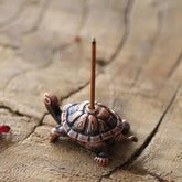 Alloy Turtle Snail Incense Burner – antique copper turtle with incense stick on stone, spiritual meditation accent