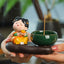 Tang Dynasty Lady Ceramic Incense Burner – Chubby lady in yellow dress holding orange beside green bowl, hand-presented warmth