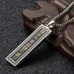 Nine-Word Mantra Bagua Yin Yang Titanium Steel Pendant - Two-tone silver-gold pendant on wood, men spiritual jewelry