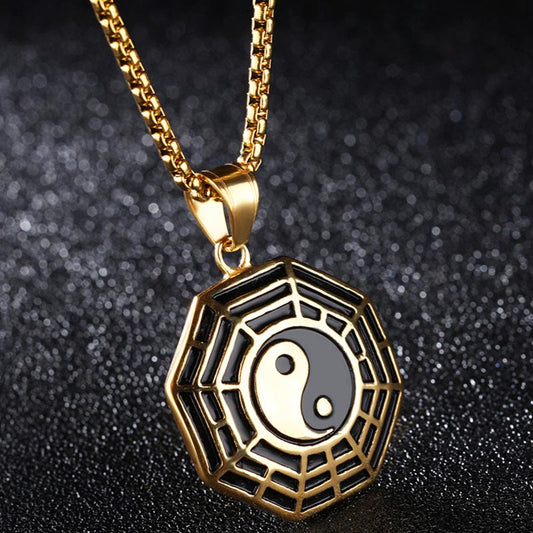 Titanium Steel Bagua Yin Yang Necklace - Gold Bagua pendant on dark sparkling backdrop, spiritual jewelry