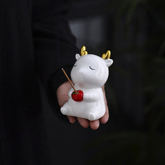Deer Ceramic Incense Burner – White deer held in hand, gold antlers and red apple, incense burning, ceramic figurine