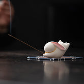 Flying Rabbit Ceramic Incense Burner – white rabbit with smoke on dark surface, ceramic incense burner