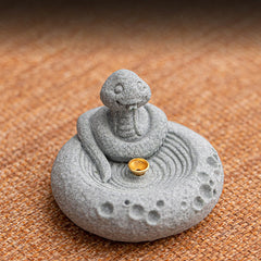 Chinese Zodiac Sandstone Incense Burner – coiled snake with robe on tan fabric, zen ripple base, brass incense cup