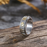 Tibetan Nine-Word Mantra Yin Yang Spinner Ring on weathered wood, silver gold worry ring