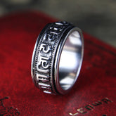 Tibetan Spinner Ring on red leather, silver mantra meditation ring