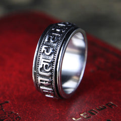 Tibetan Spinner Ring on red leather, silver mantra meditation ring