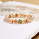999 Sterling Silver Citrine Om Mani Padme Hum Bracelet – golden citrine beads with green and red cloisonne enamel lotus charm on white surface, spiritual healing bracelet