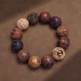 Sandalwood Dragon Phoenix Zodiac Bracelet – multi-wood zodiac beads overhead on brown texture, Healing