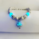 Tibetan Turquoise Glowstone Lotus Bracelet – white howlite beads with cyan glowing lotus pendant on wrist, glowstone bracelet