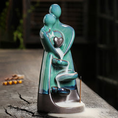 Ceramic Lovers Embrace Backflow Incense Burner - Teal figures, cascading white smoke, wood, healing decor