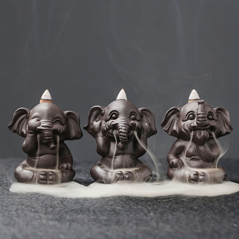 Cute Elephant Incense Burner – Three elephants with smoke waterfall on stone, backflow effect