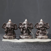 Cute Elephant Incense Burner – Three elephants with smoke waterfall on stone, backflow effect