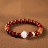 Cinnabar Wood Lotus Fu Bracelet - red beads with carved white lotus center on brown, spiritual