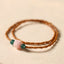 Olive Pit Lotus Double Circle Bracelet – double-strand olive pit beads with carved lotus and jade on cream linen, Mindful