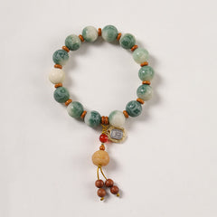 Bodhi Seed Zakiram Bracelet - Flat lay top-down view of full circular strand with tassel dangle, prayer bead bracelet